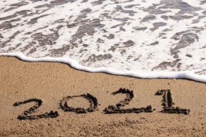 2021 written in sand on the beach