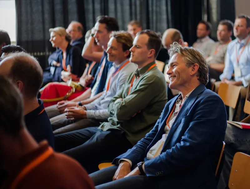 Audience attending a techleap summit about tech in the Netherlands listening to tech leaders