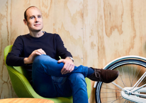 Pieter van der Does, founder of Adyen,posing in a chair
