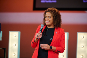 Photo of Ingrid Tappin, speaking in front of a crowd